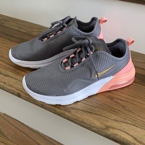 Gray and pink Nike Air tennis shoes